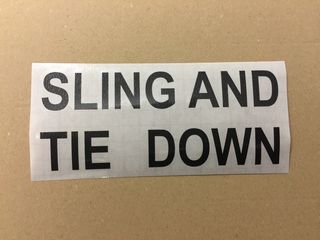 decal "SLING AND TIE DOWN"