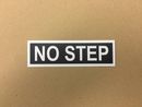 decal "NO STEP" black background